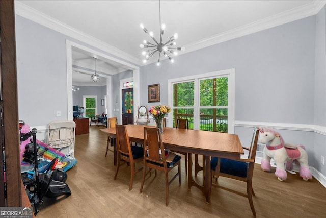 9035 Walnut Cove Ct, Gainesville, GA 30506 - dining area with wood finished floors, crown molding, a chandelier, and plenty of natural light