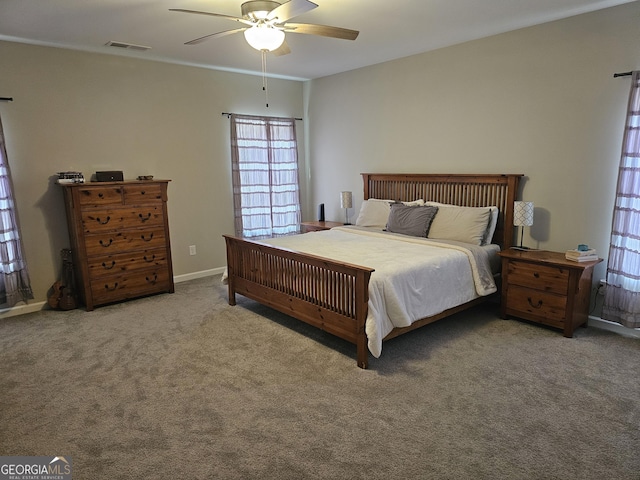 1698 W 5th Hwy, Carrollton, GA 30117 - bedroom featuring multiple windows, carpet flooring, and a ceiling fan