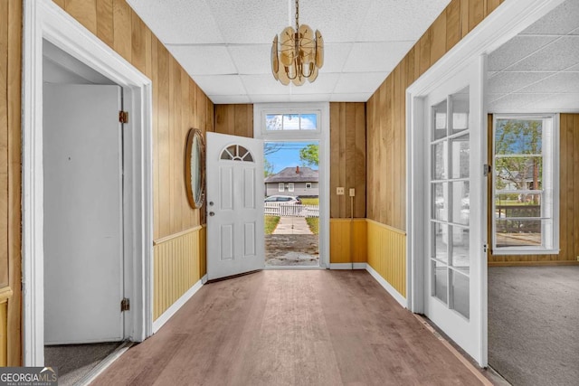510 Edgewood Ave, Macon, GA 31201 - entrance foyer with wood walls, a chandelier, a drop ceiling, and wood finished floors