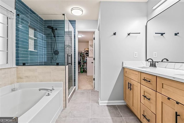 2865 Winter Rose, Dunwoody, GA 30360 - bathroom with a stall shower, tile patterned flooring, double vanity, a bath, and a walk in closet