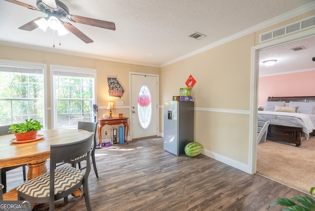 3251 Harrell Rd, Whigham, GA 39897 - foyer with a ceiling fan, a textured ceiling, crown molding, and wood finished floors