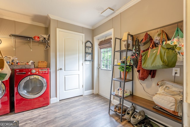 3251 Harrell Rd, Whigham, GA 39897 - washroom featuring washing machine and dryer, wood finished floors, and ornamental molding