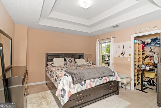 5865 El Segundo Way, Atlanta, GA 30349 - bedroom with a tray ceiling, light colored carpet, a spacious closet, a closet, and access to exterior