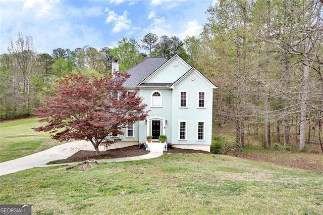 1772 Brittany Chase, Kennesaw, GA 30152 - view of front of property featuring a chimney, a front yard, and stucco siding