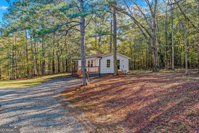 580 Vaughn Rd, Griffin, GA 30223 - view of front of house featuring a wooded view and covered porch