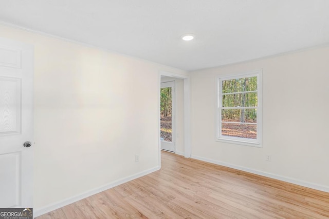 580 Vaughn Rd, Griffin, GA 30223 - unfurnished room with light wood-style floors, baseboards, and ornamental molding