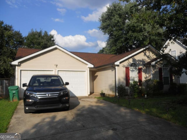 4032 Ward Lake Trl, Ellenwood, GA 30294 - ranch-style home with concrete driveway and an attached garage