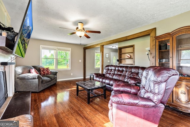 68 Riveree Rd, Brooks, GA 30205 - living room featuring a textured ceiling, ceiling fan, and wood-type flooring