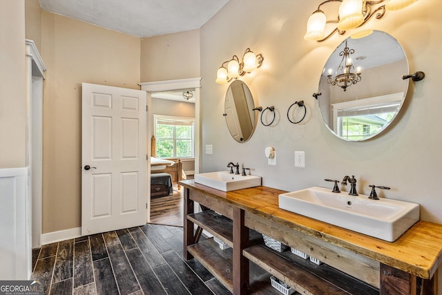 68 Riveree Rd, Brooks, GA 30205 - full bathroom featuring a chandelier, wood finished floors, and double vanity
