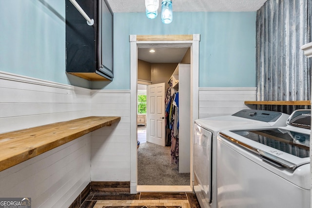 68 Riveree Rd, Brooks, GA 30205 - laundry area with washing machine and clothes dryer, dark wood-style floors, a textured ceiling, wainscoting, and wooden walls