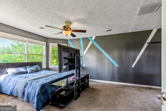 68 Riveree Rd, Brooks, GA 30205 - bedroom with carpet floors, a textured ceiling, and a ceiling fan