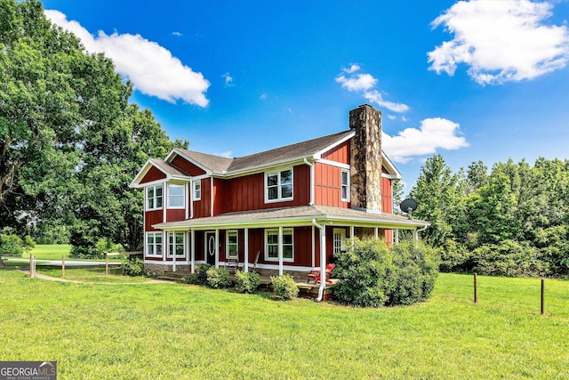 68 Riveree Rd, Brooks, GA 30205 - view of front of property featuring covered porch, a chimney, and board and batten siding