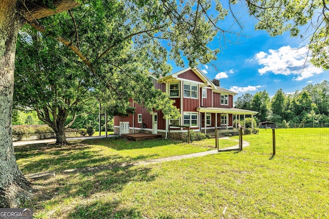 68 Riveree Rd, Brooks, GA 30205 - back of property featuring a yard, board and batten siding, and a chimney