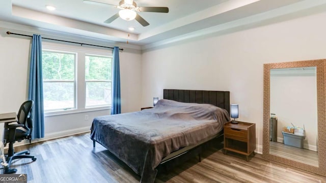 3410 Summerpoint Xing, Cumming, GA 30028 - bedroom featuring wood finished floors, baseboards, a desk, ceiling fan, and a raised ceiling