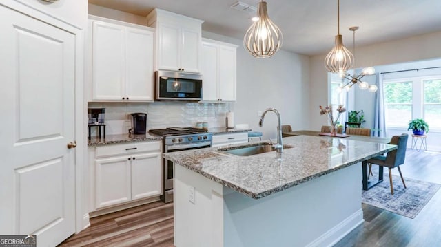 3410 Summerpoint Xing, Cumming, GA 30028 - kitchen with appliances with stainless steel finishes, a sink, dark wood-type flooring, and tasteful backsplash