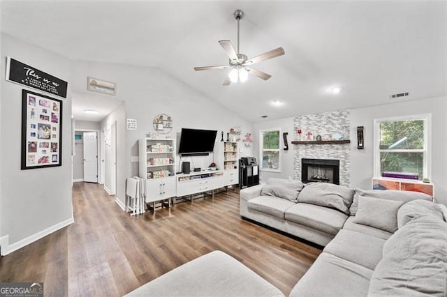 10650 Colony Glen Dr, Johns Creek, GA 30022 - living area with ceiling fan, vaulted ceiling, wood finished floors, a stone fireplace, and baseboards