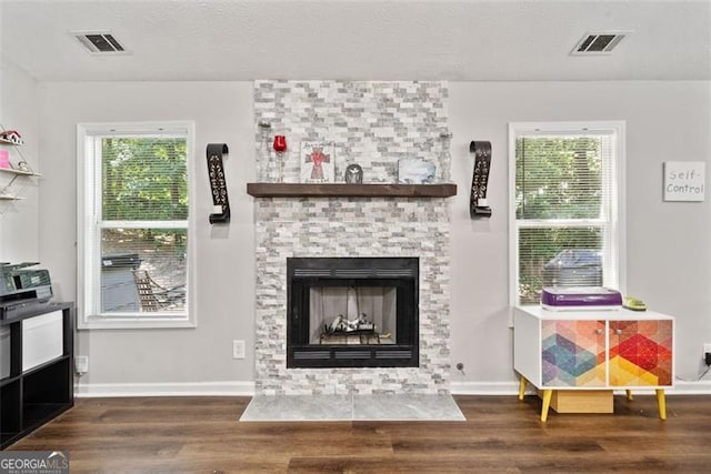10650 Colony Glen Dr, Johns Creek, GA 30022 - living room with wood finished floors, a fireplace, plenty of natural light, and baseboards