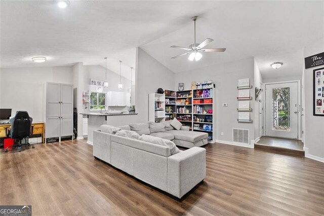 10650 Colony Glen Dr, Johns Creek, GA 30022 - living area with lofted ceiling, an office area, wood finished floors, a ceiling fan, and baseboards