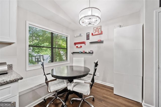 10650 Colony Glen Dr, Johns Creek, GA 30022 - dining room with vaulted ceiling, a chandelier, and wood finished floors