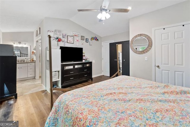 10650 Colony Glen Dr, Johns Creek, GA 30022 - bedroom featuring vaulted ceiling, wood finished floors, baseboards, and ceiling fan