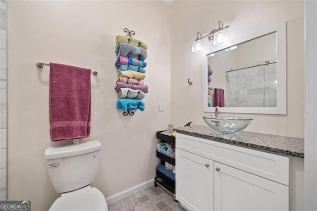 10650 Colony Glen Dr, Johns Creek, GA 30022 - full bath with baseboards, toilet, vanity, and a shower