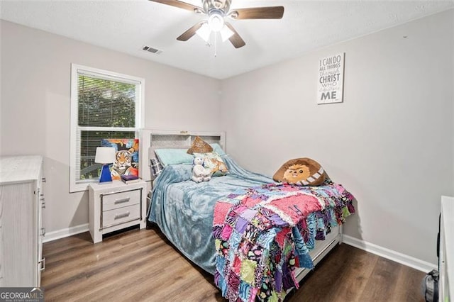 10650 Colony Glen Dr, Johns Creek, GA 30022 - bedroom with baseboards, wood finished floors, and a ceiling fan
