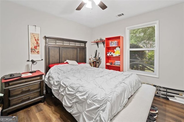 10650 Colony Glen Dr, Johns Creek, GA 30022 - bedroom with wood finished floors and ceiling fan