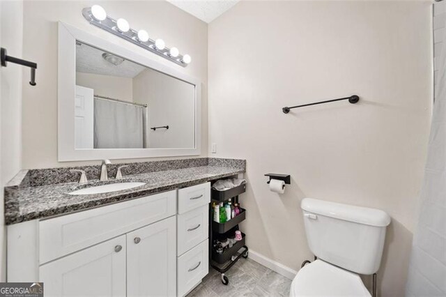 10650 Colony Glen Dr, Johns Creek, GA 30022 - bathroom featuring vanity and toilet