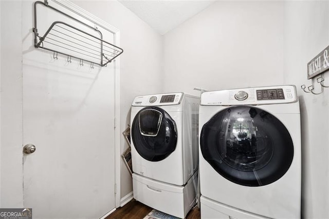 10650 Colony Glen Dr, Johns Creek, GA 30022 - laundry room with washer and clothes dryer and dark wood-type flooring