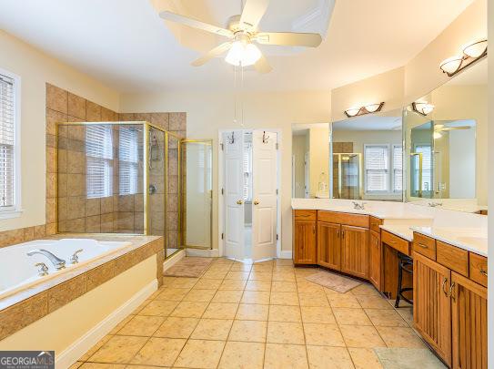 2810 Promenade Pl, Buford, GA 30519 - bathroom with a ceiling fan, a stall shower, a garden tub, vanity, and tile patterned flooring