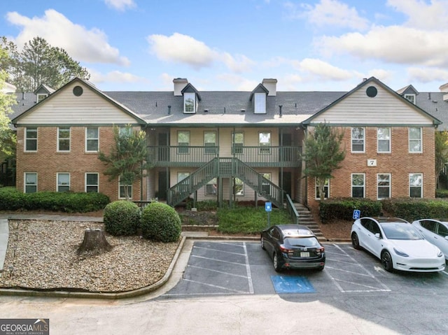 705 Beaufort Cir, Duluth, GA 30096 - view of property featuring stairs and uncovered parking