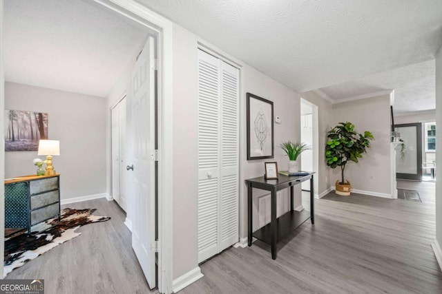 705 Beaufort Cir, Duluth, GA 30096 - corridor featuring wood finished floors, baseboards, and a textured ceiling