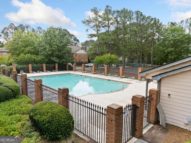 705 Beaufort Cir, Duluth, GA 30096 - community pool with a patio area