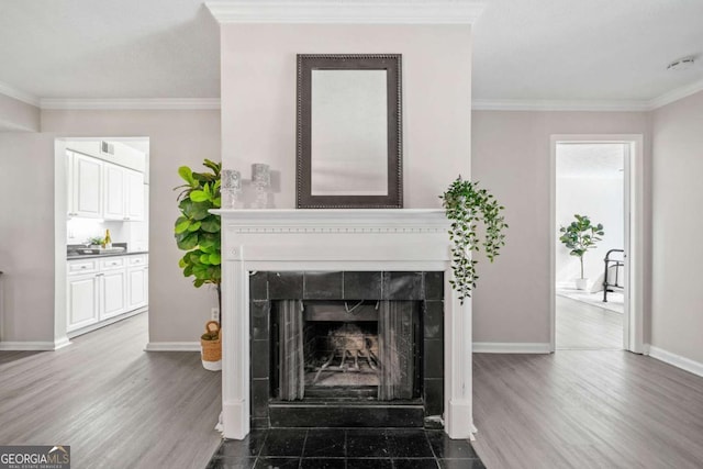 705 Beaufort Cir, Duluth, GA 30096 - living room featuring ornamental molding, baseboards, a fireplace, and wood finished floors
