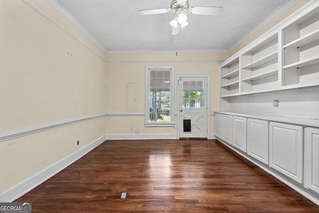 441 Crumbley Rd, Mcdonough, GA 30252 - spare room with crown molding, dark wood-style flooring, a ceiling fan, and baseboards