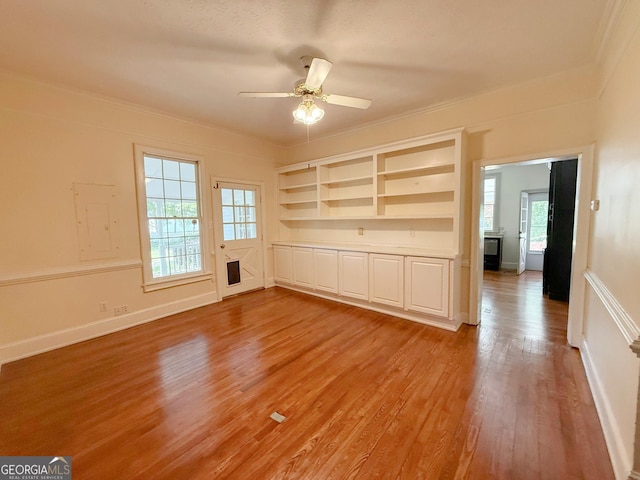 441 Crumbley Rd, Mcdonough, GA 30252 - unfurnished room with light wood finished floors, a ceiling fan, crown molding, and baseboards