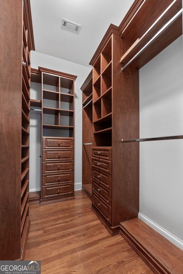 441 Crumbley Rd, Mcdonough, GA 30252 - spacious closet with wood finished floors