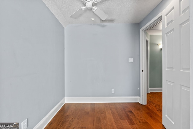 441 Crumbley Rd, Mcdonough, GA 30252 - spare room featuring wood finished floors, a ceiling fan, a textured ceiling, and baseboards
