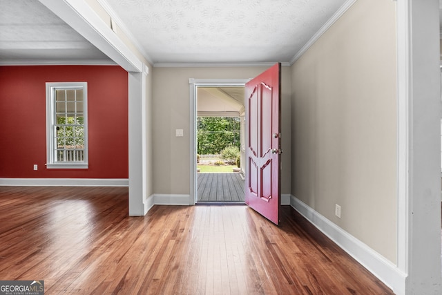 441 Crumbley Rd, Mcdonough, GA 30252 - foyer entrance featuring hardwood / wood-style floors, ornamental molding, baseboards, and a textured ceiling