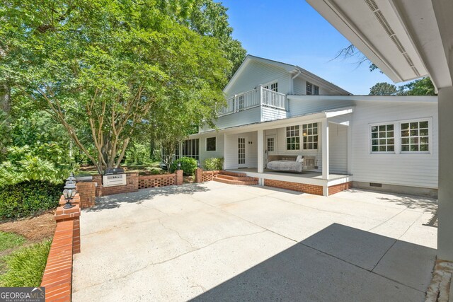 441 Crumbley Rd, Mcdonough, GA 30252 - back of house featuring a balcony, crawl space, and a patio