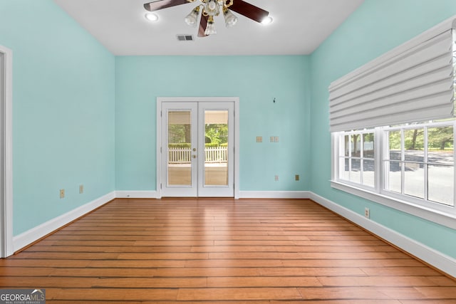 441 Crumbley Rd, Mcdonough, GA 30252 - spare room with french doors, a ceiling fan, and wood-type flooring