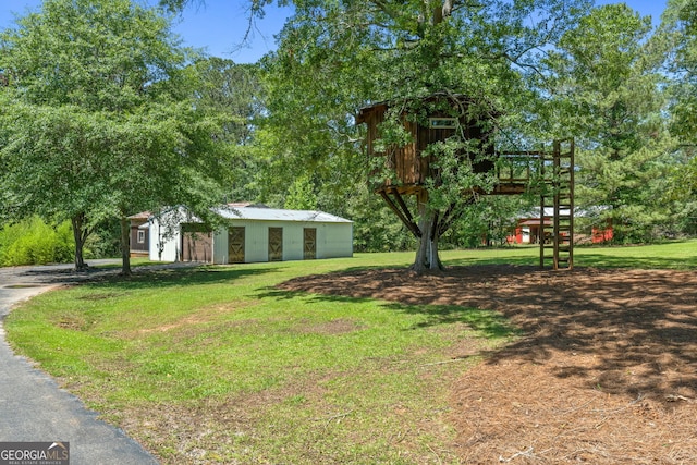 441 Crumbley Rd, Mcdonough, GA 30252 - view of grassy yard featuring an outbuilding