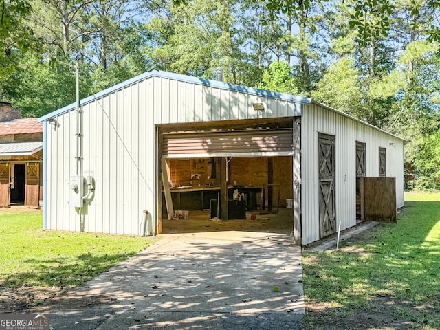441 Crumbley Rd, Mcdonough, GA 30252 - view of pole building featuring asphalt driveway and a lawn