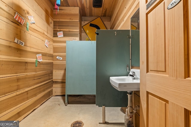 441 Crumbley Rd, Mcdonough, GA 30252 - bathroom with wooden walls, unfinished concrete floors, a sink, and wooden ceiling
