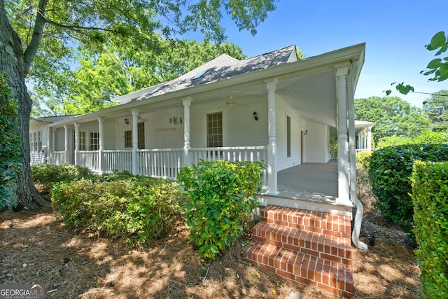 441 Crumbley Rd, Mcdonough, GA 30252 - farmhouse-style home with a porch, a ceiling fan, and a shingled roof