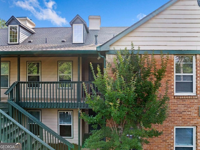 717 Beaufort Cir, Duluth, GA 30096 - rear view of property with stairway, brick siding, and a chimney