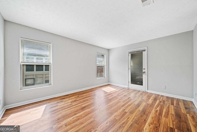 717 Beaufort Cir, Duluth, GA 30096 - unfurnished room with wood finished floors and baseboards