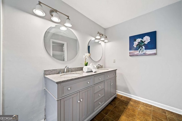 717 Beaufort Cir, Duluth, GA 30096 - bathroom with baseboards and double vanity
