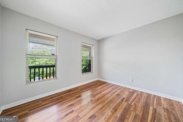 717 Beaufort Cir, Duluth, GA 30096 - unfurnished room featuring baseboards and wood finished floors