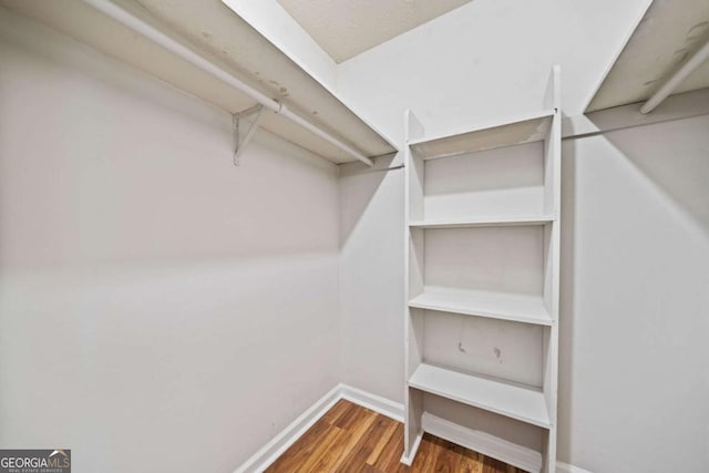 717 Beaufort Cir, Duluth, GA 30096 - spacious closet featuring wood finished floors